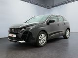 un SUV noir garé dans un garage aux murs blancs