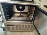 an open oven with a fan inside of it