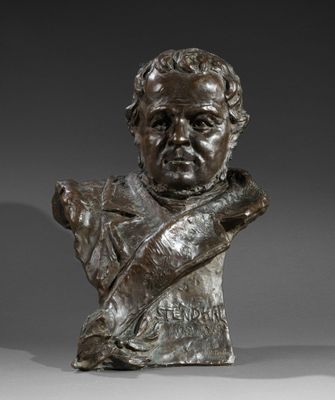a bronze bust of a man holding a knife in his right hand