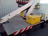 a white truck with a yellow cooler on the back