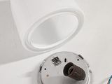 a white light that is on top of a white table
