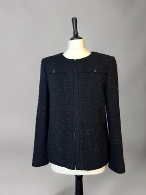 a close up of a black jacket on a mannequin mannequin