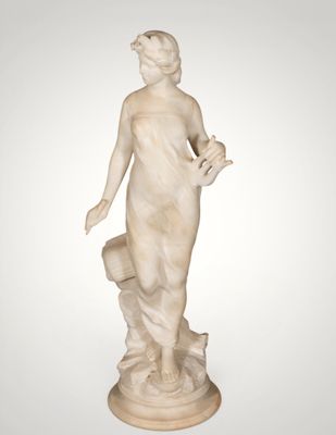 an image of a statue of a woman with a bird in her hand