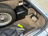 the trunk of a car with a luggage bag and a suitcase in it
