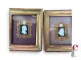 two framed pictures of a man and a woman in profile