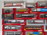 many different types of toy trucks in the box