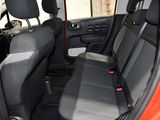 a red car with black seats in the back of it