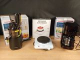 three different types of coffee makers on the table