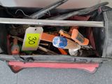 a bag full of tools sitting on the floor