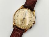 une image d'une montre-bracelet en or avec un bracelet en cuir marron