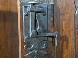 a close up of a wooden door with a lock on it