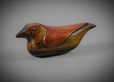 an image of a wooden bird sitting on top of a table