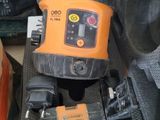 an orange and black tool in a case on the floor