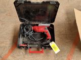 a box with a corded drill and a box with a corded drill