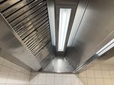 an overhead view of a commercial kitchen with stainless steel appliances