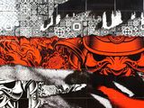 an image of a black and white picture of a man on a motorcycle in front of a mural