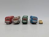four toy cars that are sitting next to each other