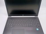 a laptop that is open on a white table