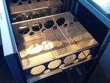 an open oven with a lot of food inside of it