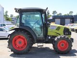a tractor that is parked in a parking lot