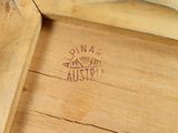a close up of a piece of wood with writing on it