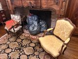 a chair that is sitting in front of a fire place