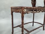 a small wooden table with a small table top on it