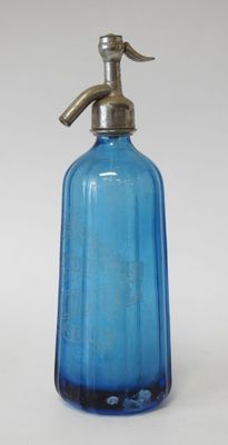 blue glass soap dispenser with a brass handle