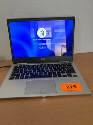 dell laptop computer on a desk with a price tag on the screen