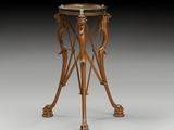 une table ancienne en bois avec un plateau en verre et deux oiseaux posés dessus
