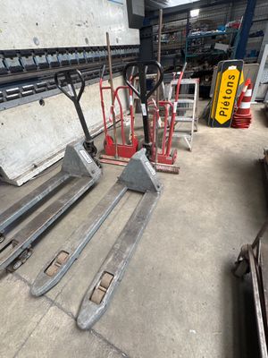 a fork and a pallet in a warehouse