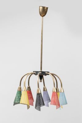 a close up of a chandelier with five colorful lamps hanging from it