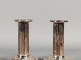 pair of antique silver candlesticks with fluted bases