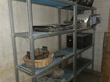 a metal shelf with a bunch of items on top of it