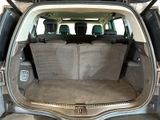 the back of a car with the trunk open and the seats folded down