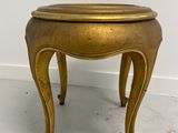 an image of a small brass table with a wooden top