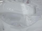 a close up of a toilet bowl with a plastic cover on it