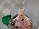 three glass vases sitting next to each other on a table