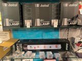a display of electronic items on a shelf in a store