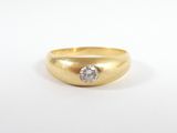 a close up of a gold ring with a diamond in the center