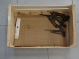two pairs of scissors in a box on the floor