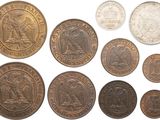 an assortment of old british coins on a white background