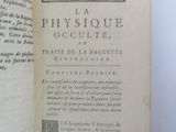 an open book on a white table with a black and white picture