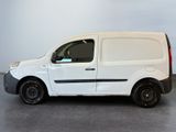 the white van is parked in a large room with a gray floor