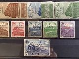 a lot of stamps that are on display in a case