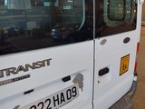 a transit bus parked in a parking lot next to a building