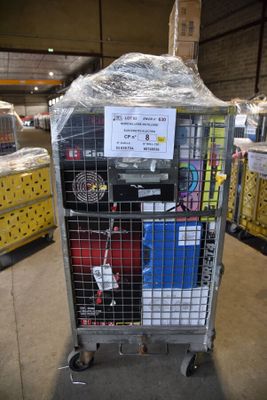 a metal cart with a sign on it in a warehouse