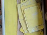 a picture of a picture of a yellow piece of paper on the floor