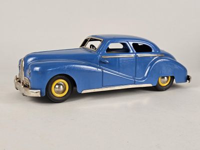 a blue toy car that is sitting on a white surface