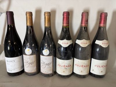 several bottles of wine are lined up on a shelf